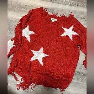 Distressed star sweater
